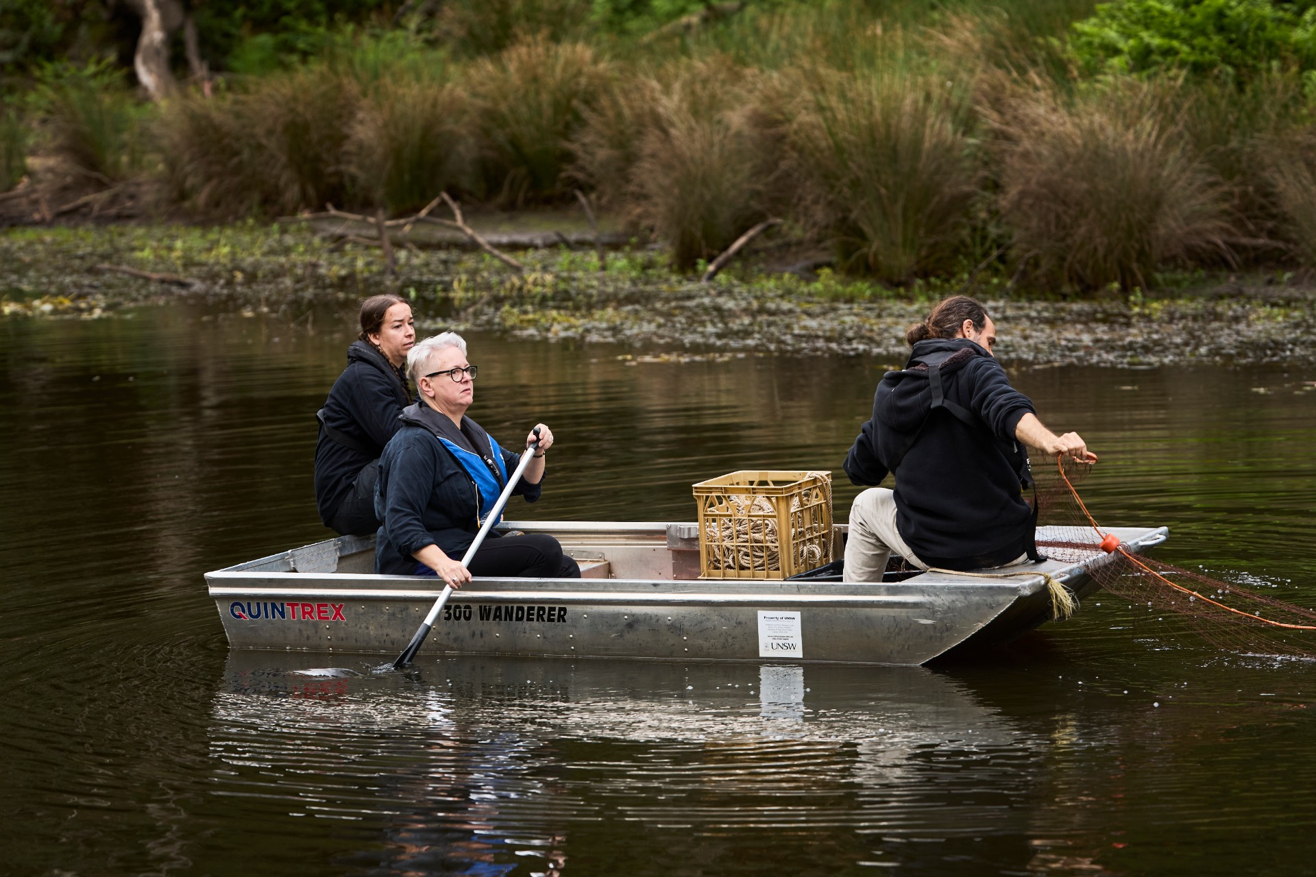 Environment Minister Penny Sharpe, and scientists Tahneal Hawke and Gilad Bino in a boat on the Hacking River
